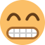 An emoji of a grimacing yellow face with its teeth clenching.