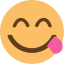 Yum emoji - A face with a tongue sticking out of one corner of its mouth.