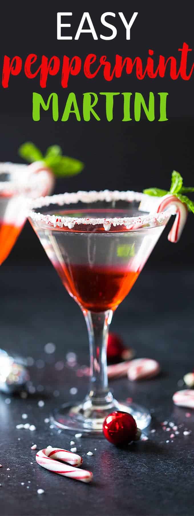 Front view of a peppermint martini in a glass with a crushed peppermint rim.