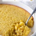 A closeup of corn pudding in a baking dish with overlay text.