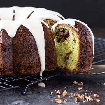 Pistachio Sock-It-To-Me Cake - A pistachio bundt cake with a nutty center and drizzled with vanilla butter glaze | theblondcook.com