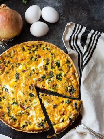 Kale Quiche - A vegetarian quiche chock full of kale, roasted red peppers, mushrooms and onions.
