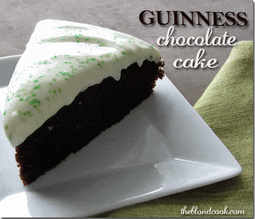 A slice of chocolate cake on a square white plate beside a green napkin. Text at top right of image.