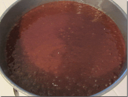 Overhead view of chocolate cake batter mixture in a pan.