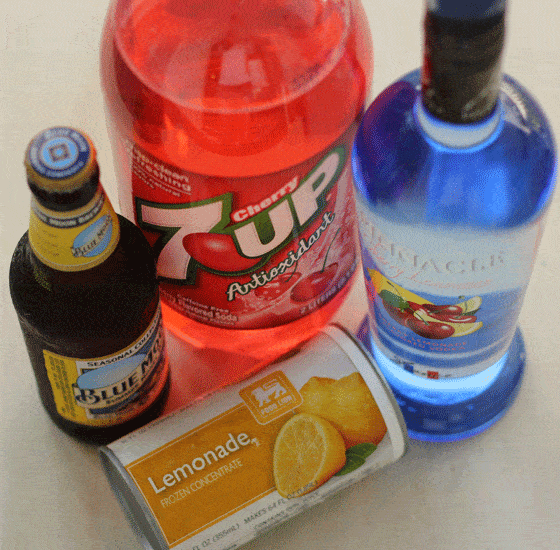 A can of lemonade concentrate and bottles of beer, vodka and cherry soda.