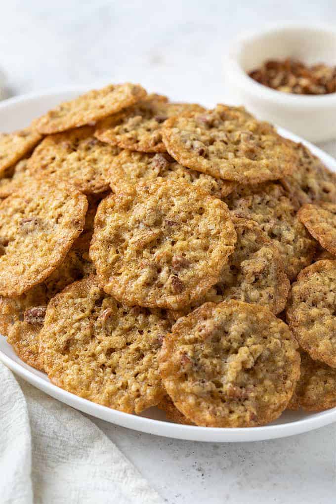 Oatmeal Lace Cookies on a white oval serving platter.