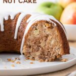 A Bundt Cake that has been sliced. Overlay text reads, "Apple Nut Cake".