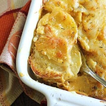 Swiss cheesy and creamy Pumpkin Scalloped Potatoes seasoned with chipotle pepper and thyme