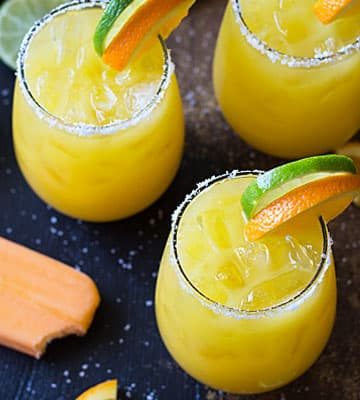 Creamsicle Margaritas - Tequila, whipped vodka, orange juice, triple sec and lime juice come together in the ultimate creamy orange margarita!