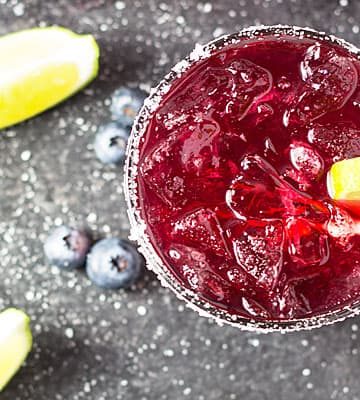 Blueberry Margaritas - Blueberry simple syrup, tequila, triple sec, margarita mix and lime juice create the ultimate blueberry margarita!