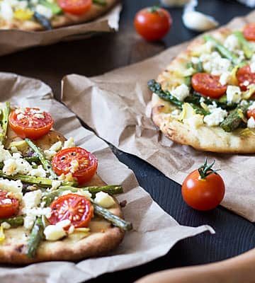Spring Harvest Pizza - An EASY flatbread pizza with asparagus, artichokes, tomatoes and feta
