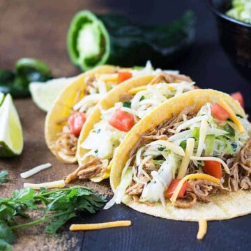 Chicken Tacos - Juicy and zesty shredded chicken with a cilantro lime poblano slaw | theblondcook.com