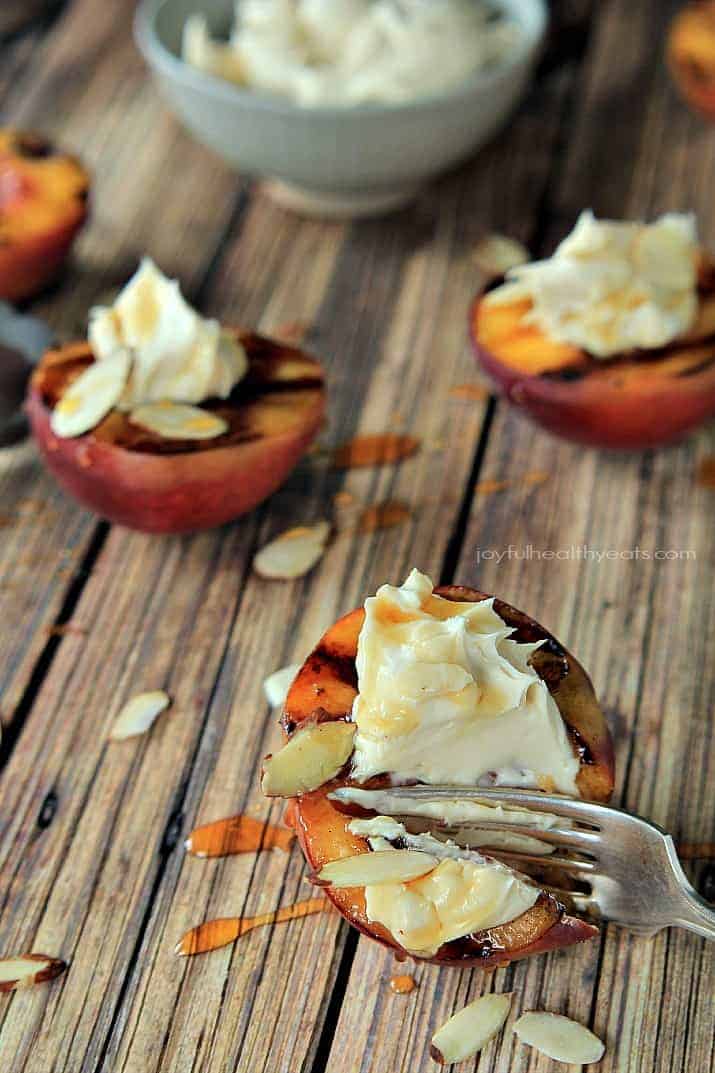Grilled Peaches with a Maple Honey Mascarpone Cheese on a wood surface.