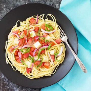 Marinated Tomato and Mozzarella Pasta - A quick, light and healthy dish that comes together in less than 20 minutes! Packed full of flavor and so delicious!
