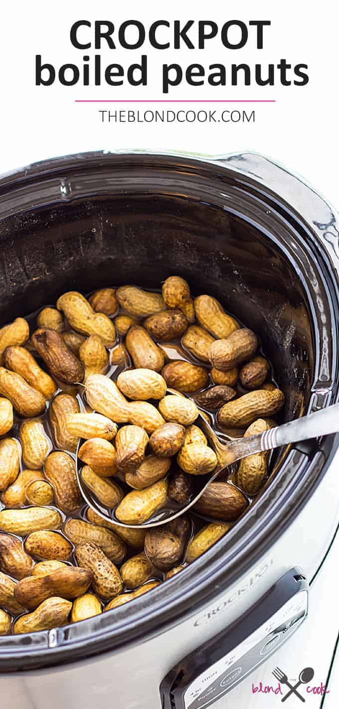Overhead view of boiled peanuts in a slow cooker.  Text at top says crockpot boiled peanuts.  