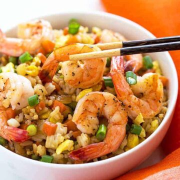 Shrimp Fried Rice - Skip the takeout and make this classic homemade version with fresh shrimp, carrots, peas, and green onions!