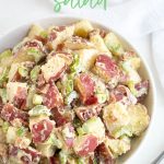 Overhead view of a bowl of potato salad. Overlay text reads, "red potato salad".