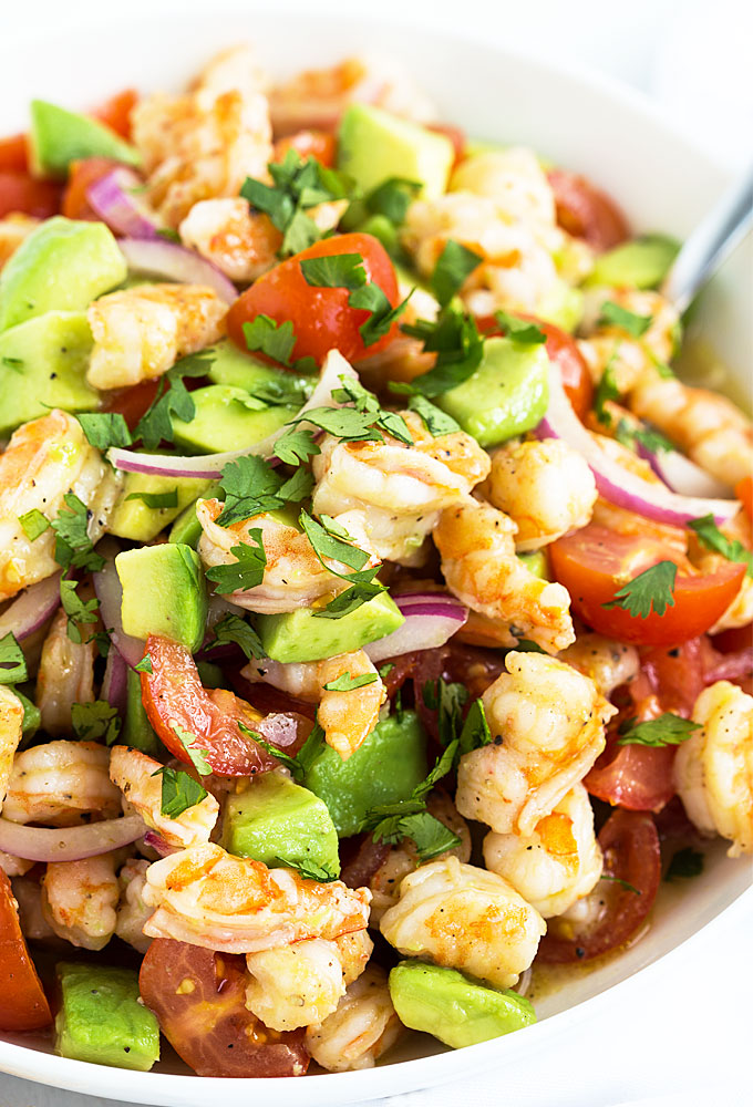 A closeup view of shrimp and avocado salad.