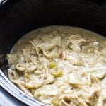 Chicken and pastry in an oval slow cooker.