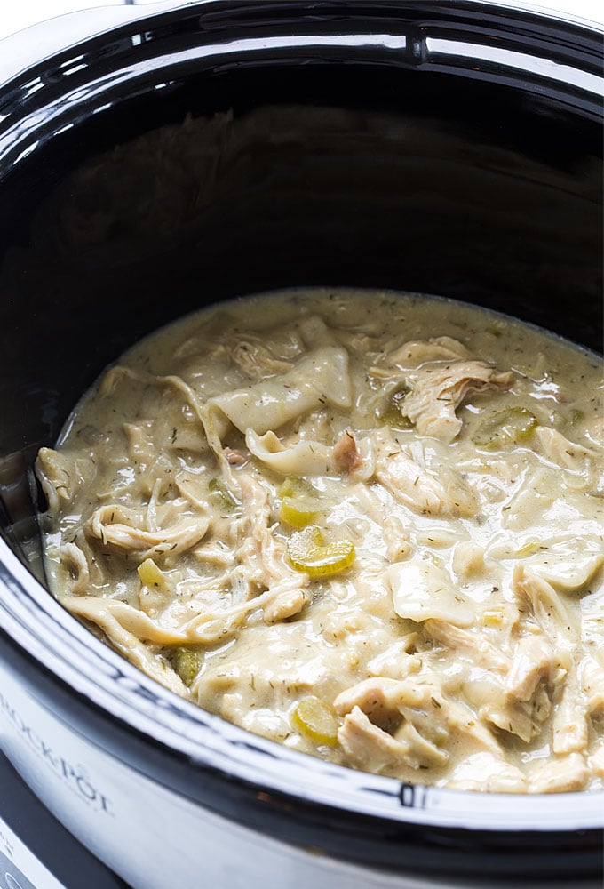 Chicken and pastry in an oval slow cooker.
