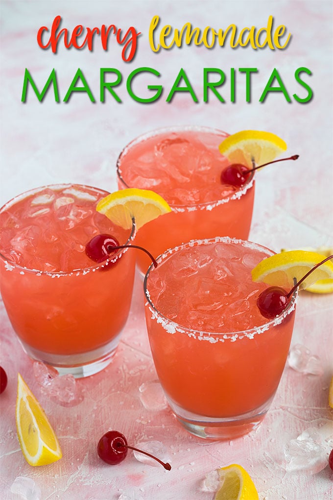 Three cherry lemonade margaritas on a pink surface with overlay text.