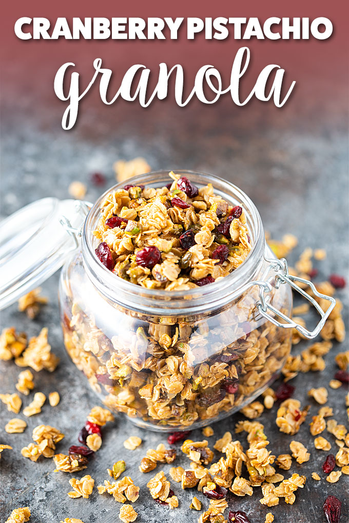 Granola in an open glass canister with overlay text at the top of image.