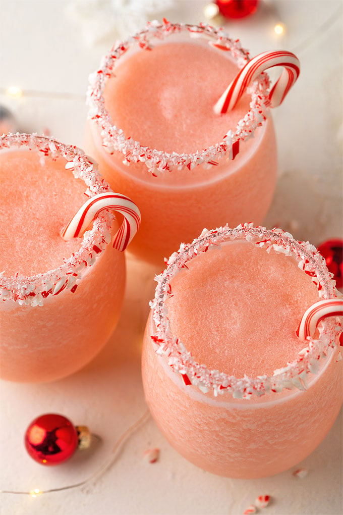 Overhead view of 3 peppermint pina coladas garnished with candy canes