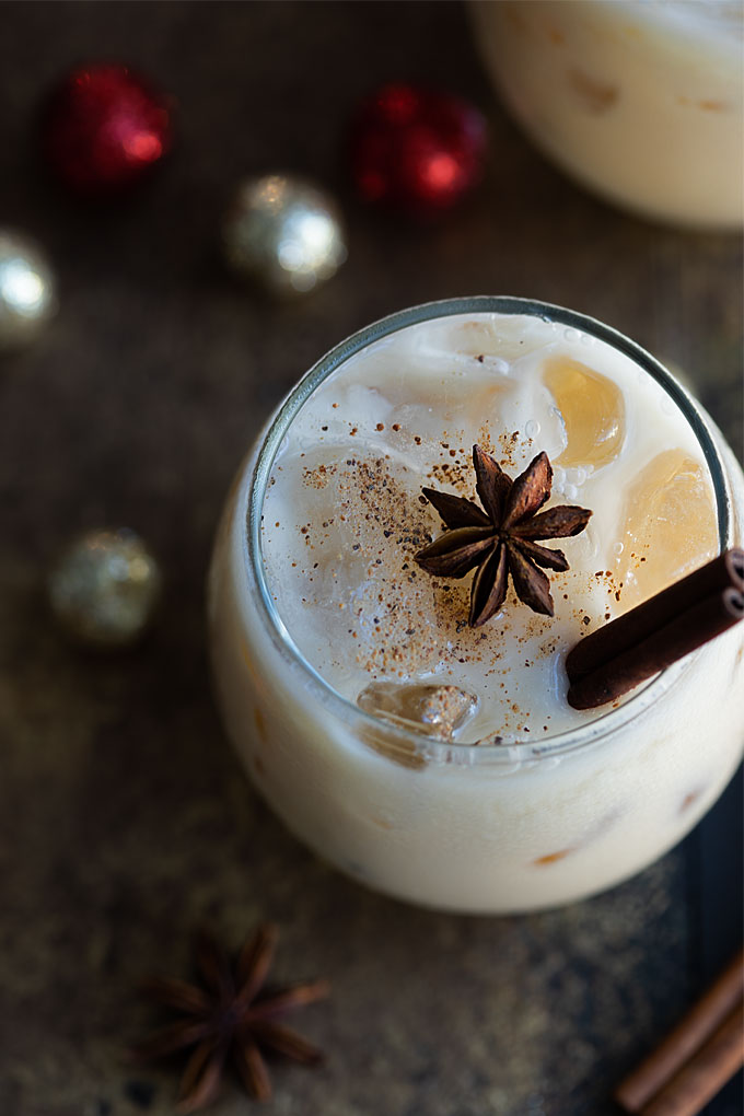 Overhead closeup view of an eggnog white russian cocktail in a glass.
