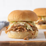 Front closeup view of a pulled pork sandwich.