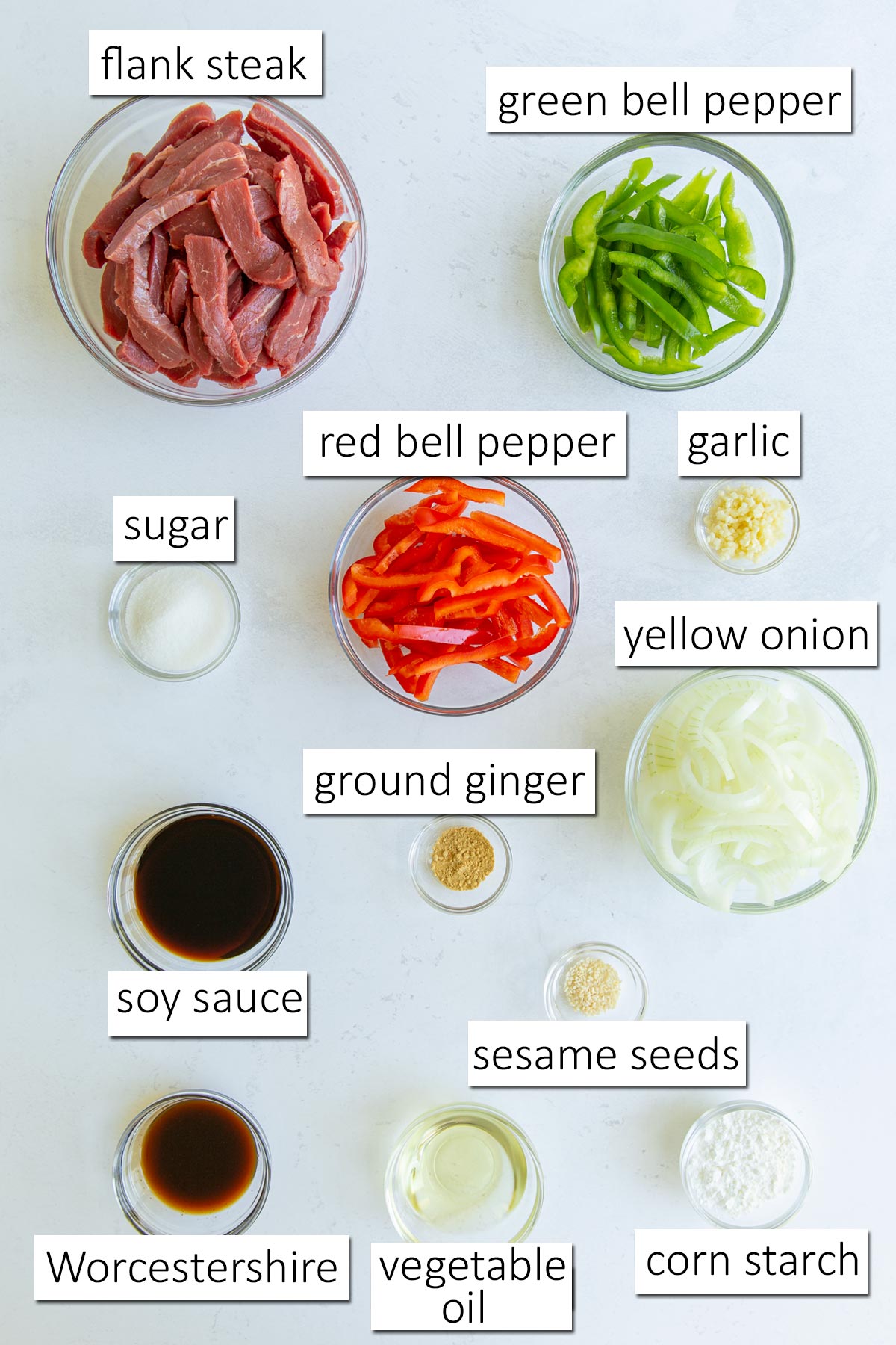 Overhead view of ingredients needed to make pepper steak and onions.