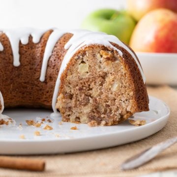 Closeup view of an apple nut Bundt cake that has been sliced.