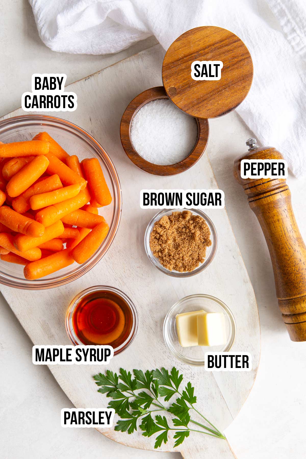 Overhead view of ingredients for making maple glazed carrots with overlay text.