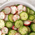 Salad in a white bowl with overlay text that reads, "cucumber radish salad".