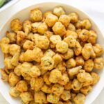 Fried okra in a white bowl. Overlay text at top of image.