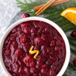 Overhead view of a bowl of cranberry sauce. Overlay text at top of image.