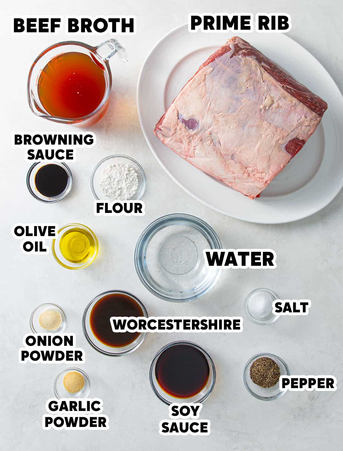 Overhead view of ingredients needed to roast a boneless prime rib with au jus.