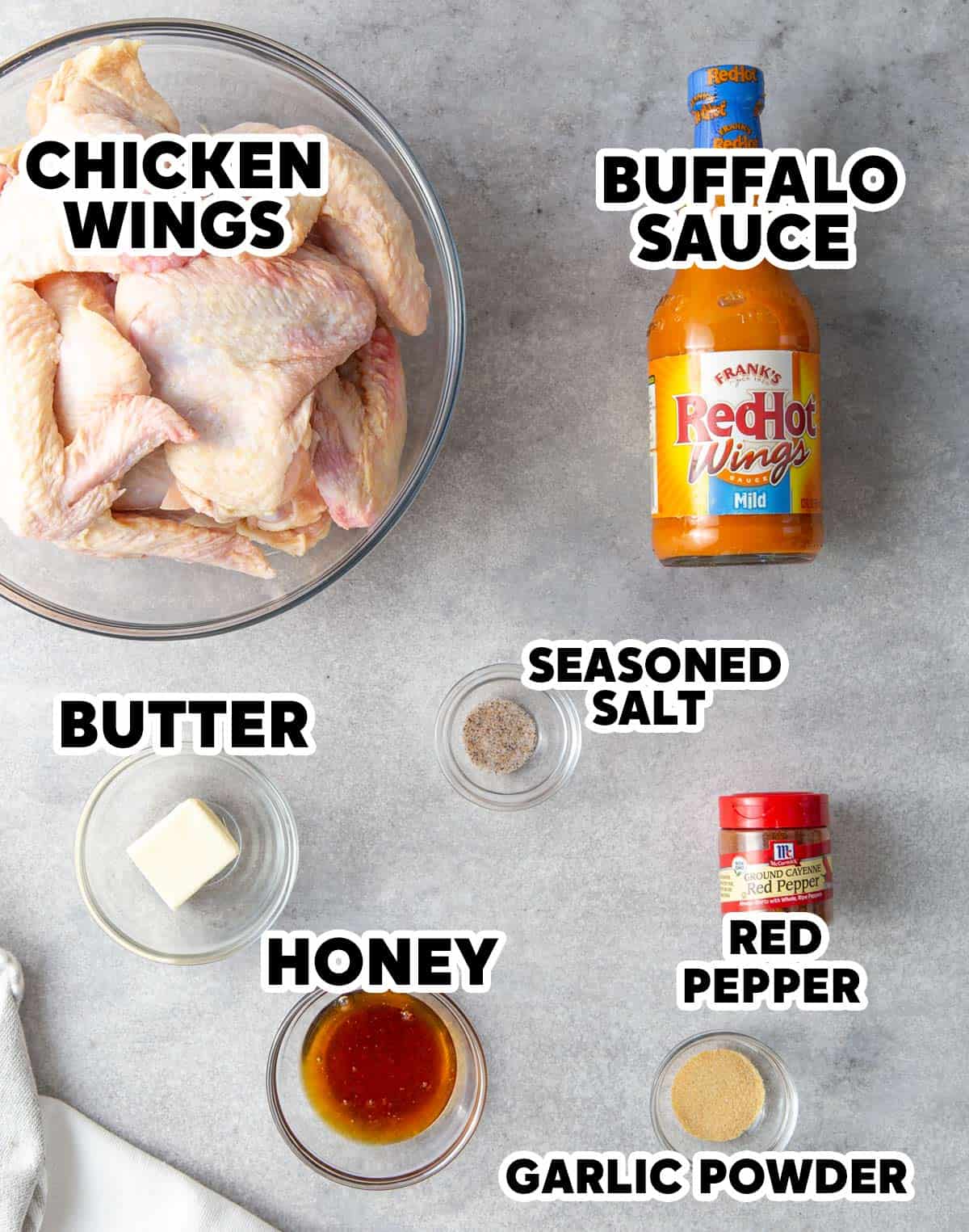 Ingredients for crock pot buffalo wings with overlay text.