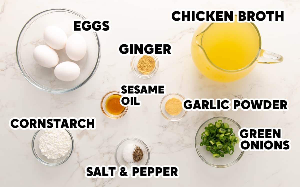 Ingredients for egg drop soup with overlay text.