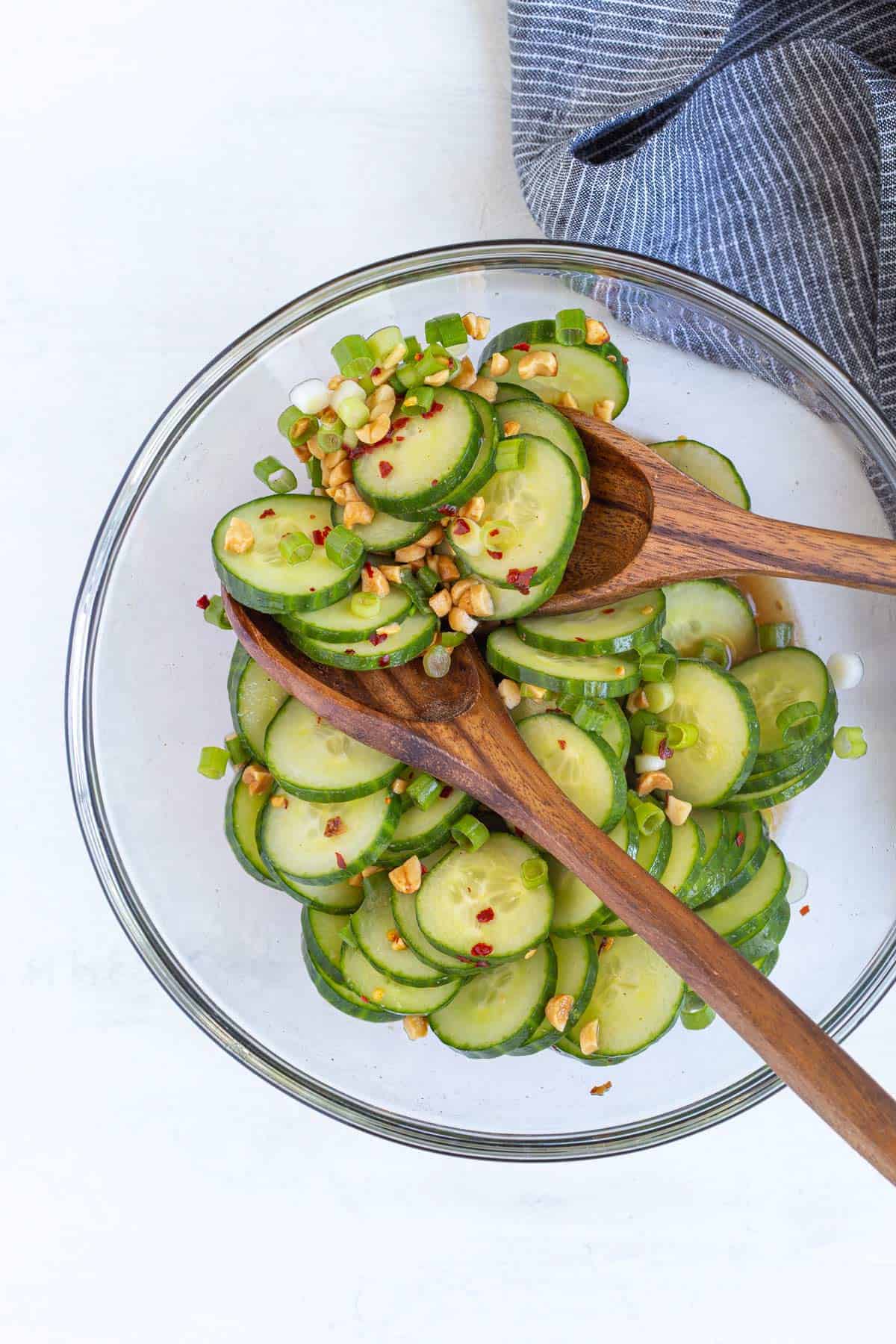 Overhead view of a bowl of Thai cucumber salad before adding dressing.