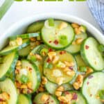 Closeup view of Thai cucumber salad in a white bowl with overlay text.