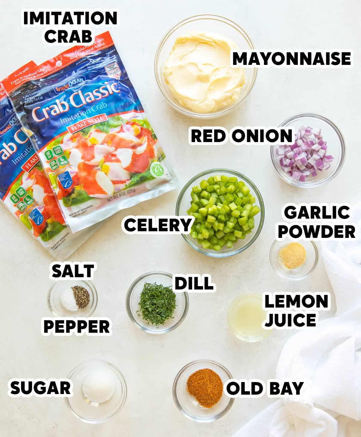 Ingredients for making imitation crab salad with overlay text.