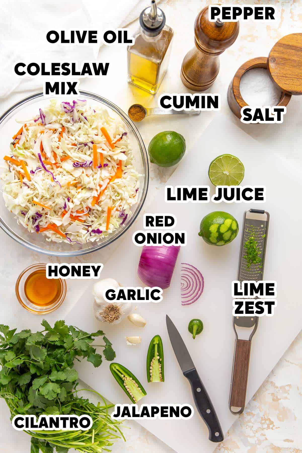 Overhead view of ingredients for making Mexican coleslaw with overlay text.