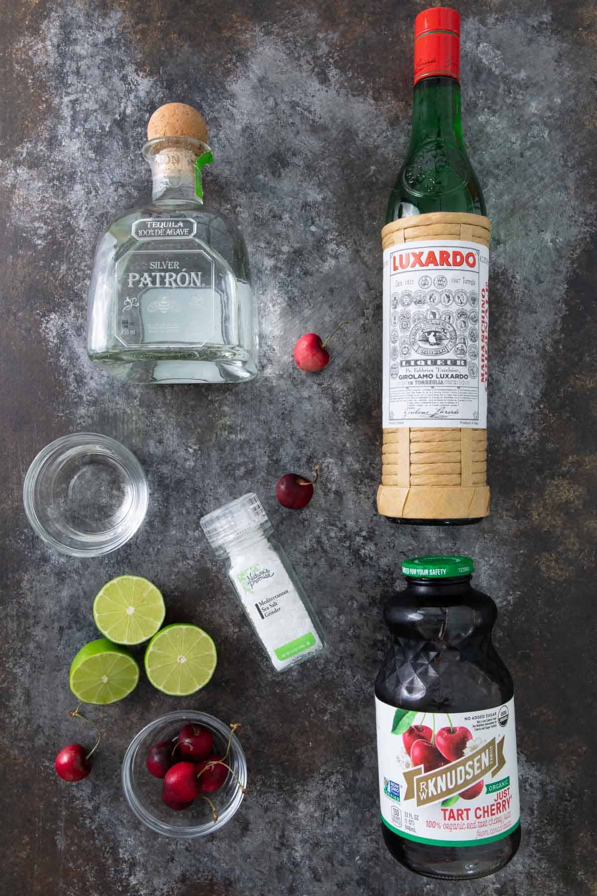 Overhead view of ingredients for making a cherry margarita.