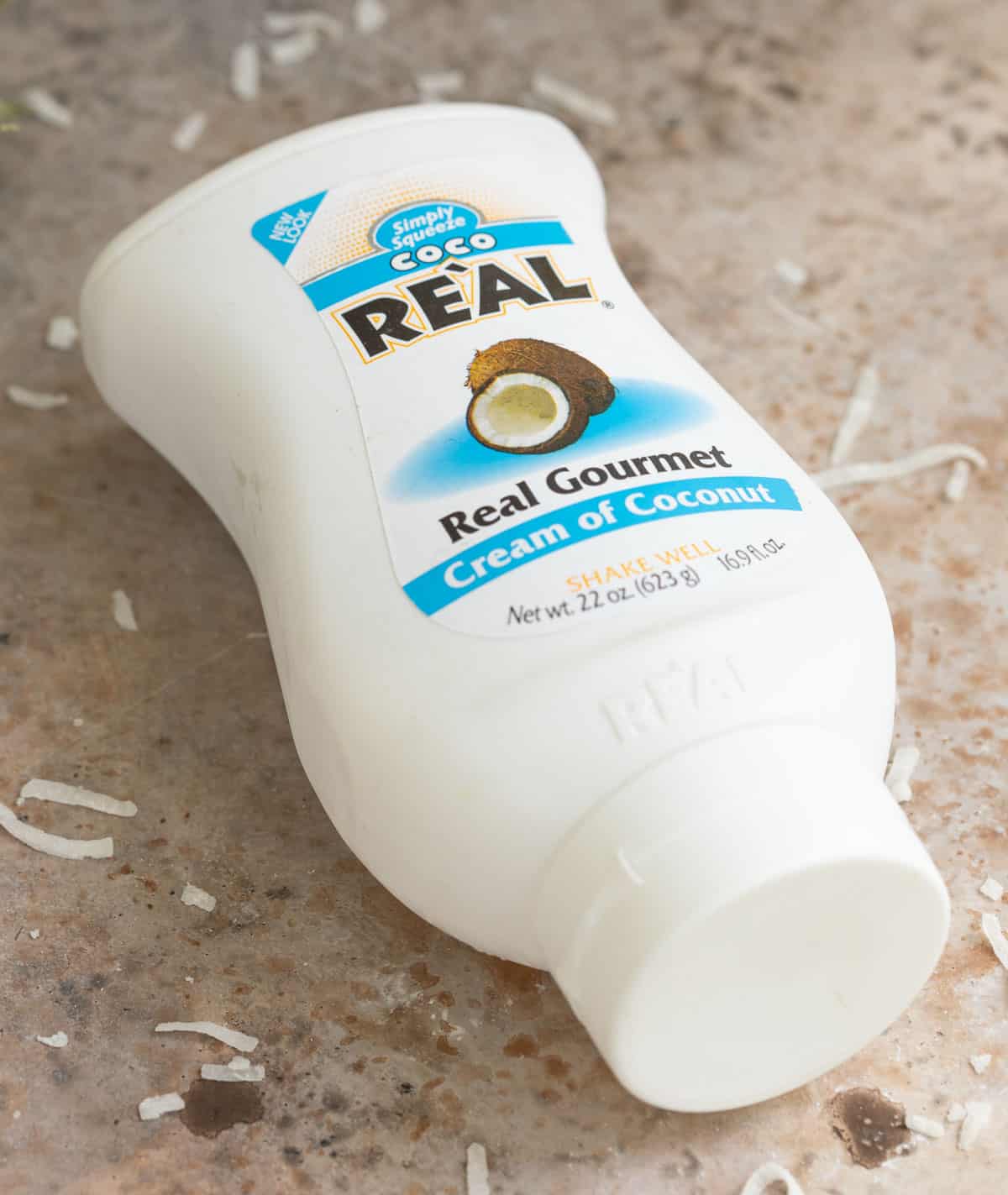 A bottle of cream of coconut for making frozen pina coladas.