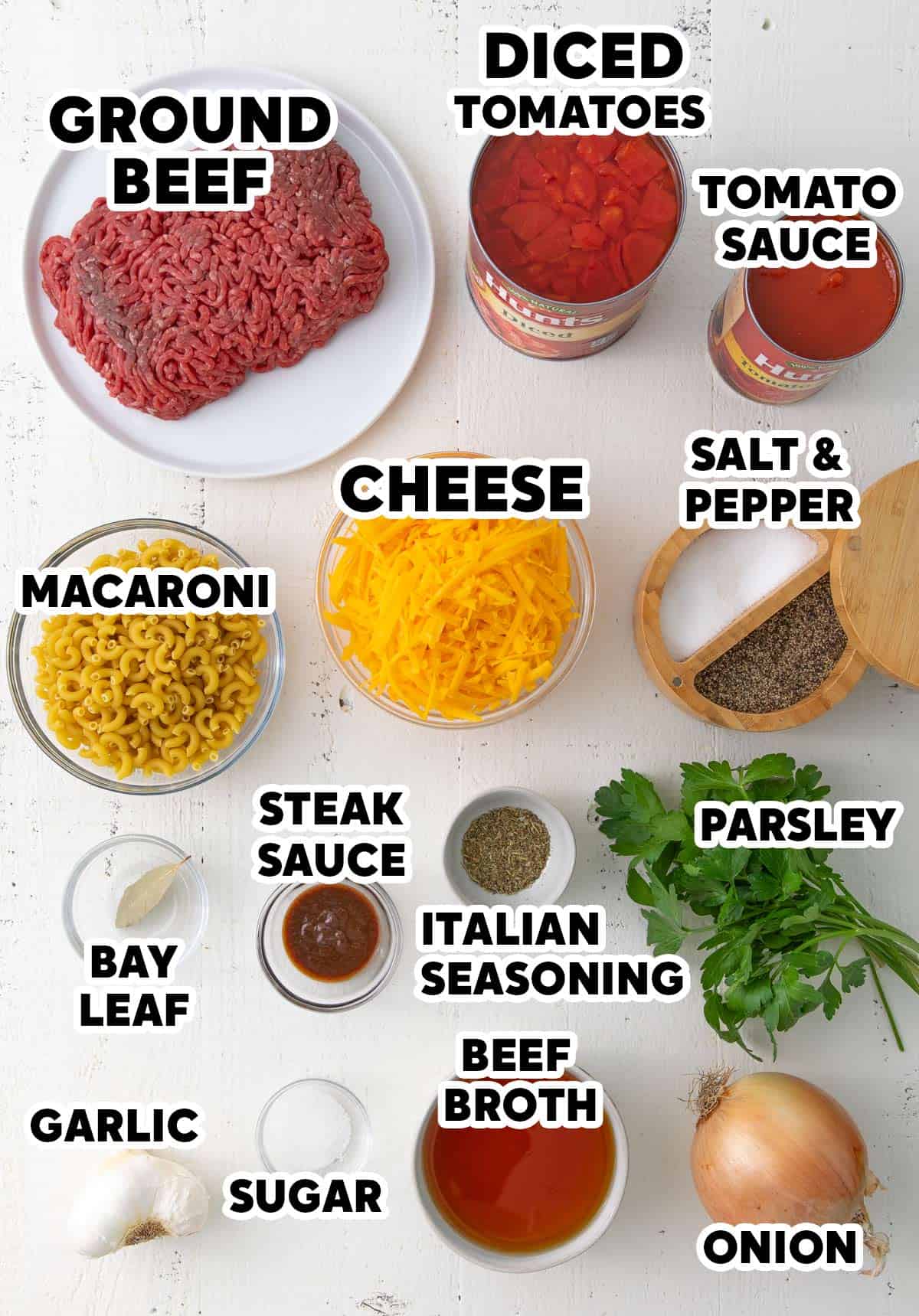 Overhead view of ingredients for making American Goulash with overlay text.