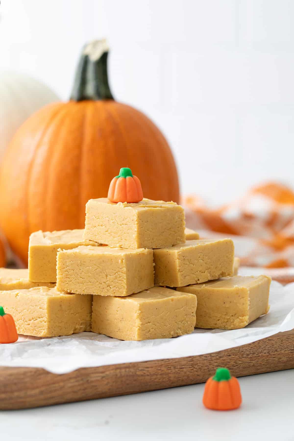 Front view of stacked pumpkin fudge squares.
