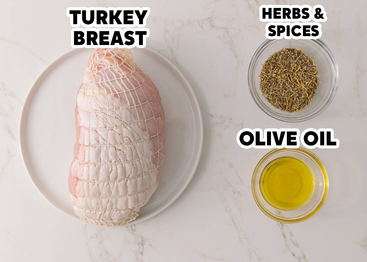 Overhead view of a boneless turkey breast in netting, a bowl of dried herbs and spices, and olive oil.