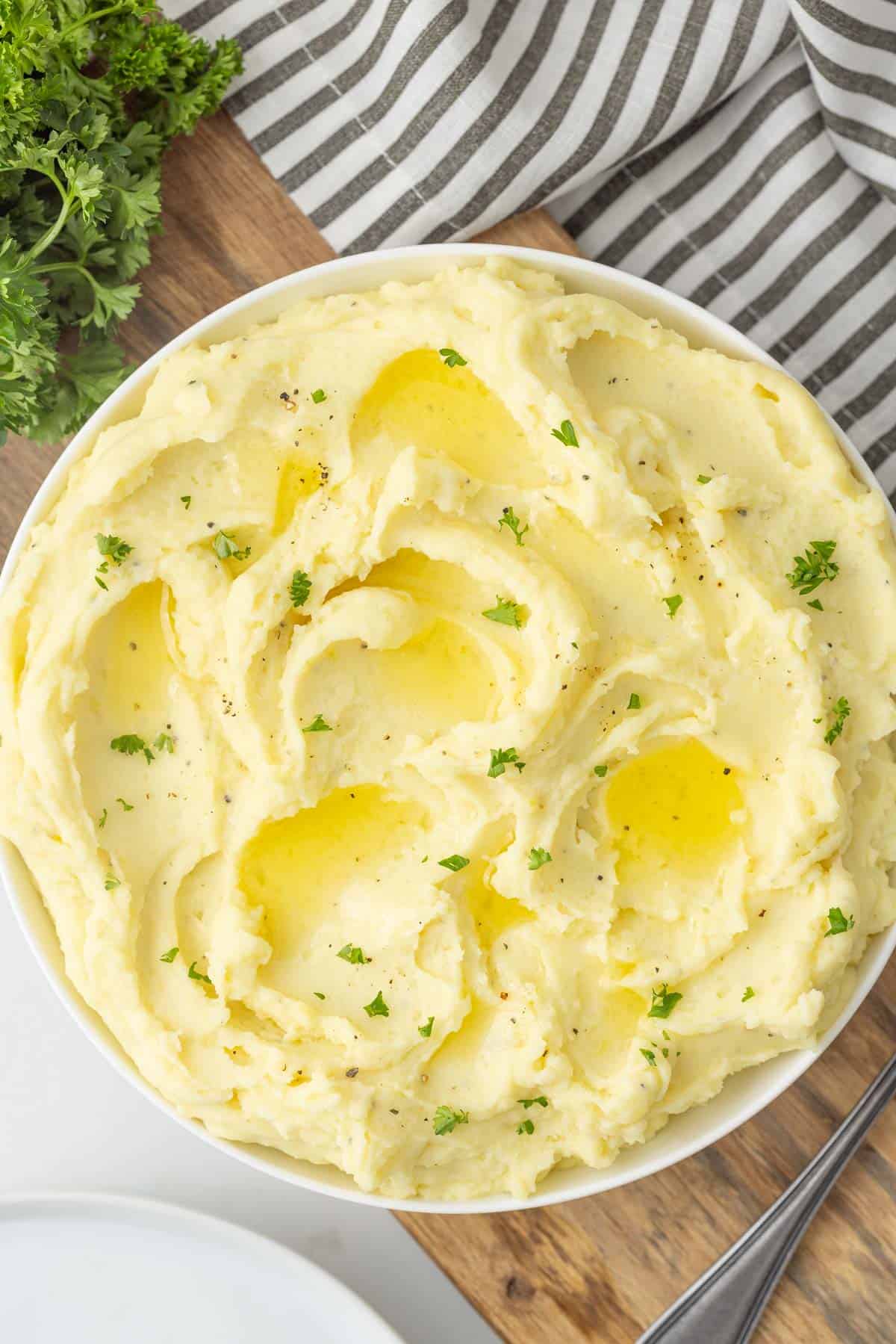 Cream cheese mashed potatoes in a white bowl.