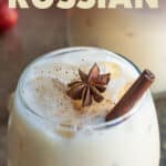 Front view of an eggnog white Russian cocktail. Overlay text is at the top of the image.