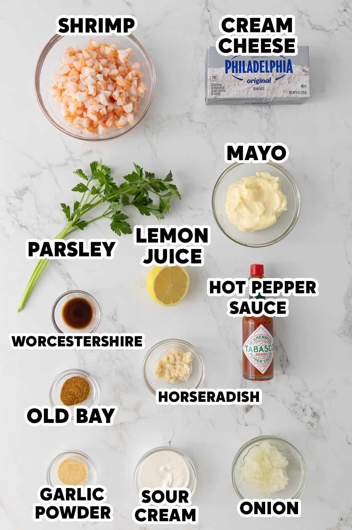 Overhead view of ingredients for making shrimp dip with overlay text.